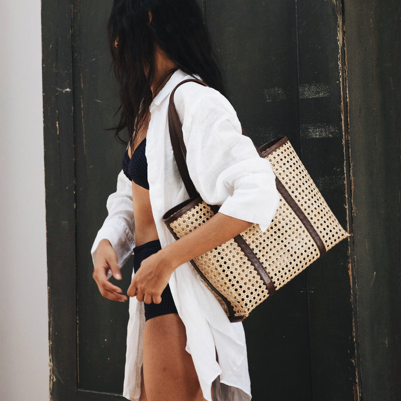 Bembien Margot Bag in Medium Chocolate Rattan on the shoulder of a woman