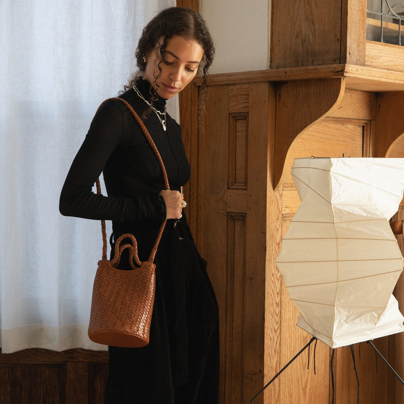 Bembien Lina Bucket in Sienna worn as a shoulder bag by a woman