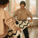 Woman styling the Bembien Moma Scarf in Cream