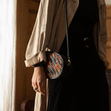 Bembien Ovale Crossbody in Sienna/Black Houndstooth worn with a trench coat