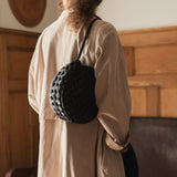 Bembien Audrey Bag Oversized Knot in Olive worn by a standing person