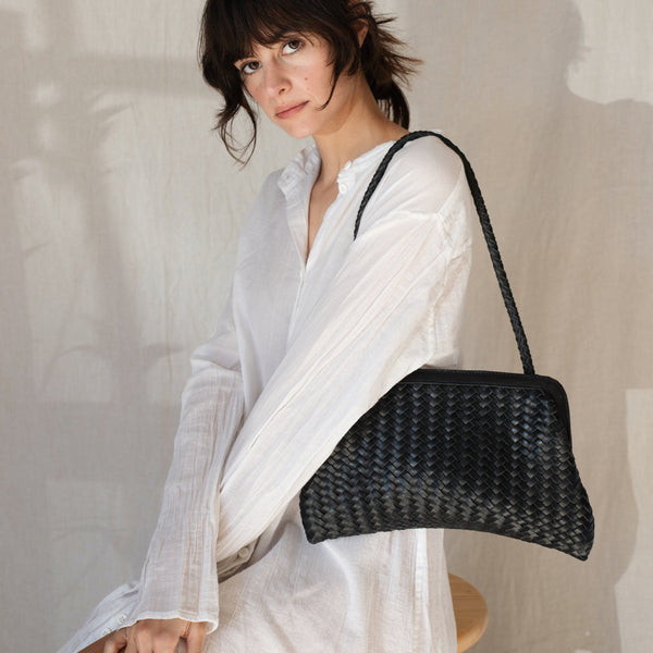 Bembien Le Sac in Black worn by a seated woman