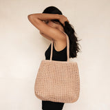 Bembien Olivia Tote in Caramel worn on the shoulder of a standing woman
