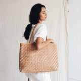 Bembien Gabrielle Bag in Caramel worn on the shoulder by a standing woman