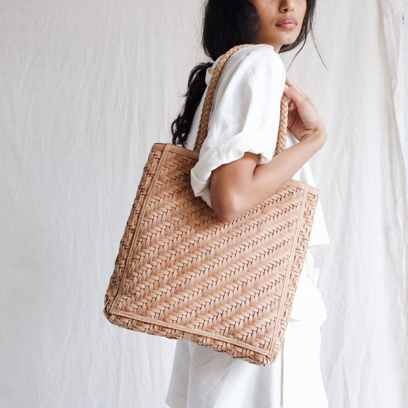 Bembien Le Tote in Caramel on the shoulder of a standing woman