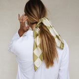 Bembien Alessia Scarf in Olive Check worn in a woman's hair