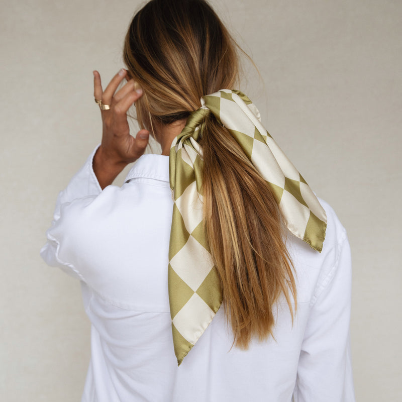 Bembien Alessia Scarf in Olive Check worn in a woman's hair