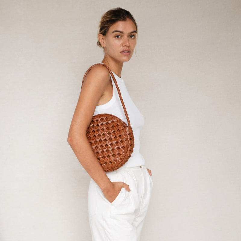 Bembien Audrey Bag Oversized Knot in Sienna worn by a standing woman
