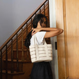 Bembien Lucia Bag in Cream on the shoulder of a standing woman